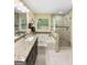 Bathroom featuring a soaking tub, walk-in shower and granite countertop vanity at 120 Hawken Trl, Mcdonough, GA 30253
