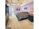 A spacious bedroom with a tray ceiling, ceiling fan and neutral colored carpet at 120 Hawken Trl, Mcdonough, GA 30253