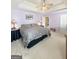 A large bedroom with carpeted floor, ceiling fan, and neutral-colored walls at 120 Hawken Trl, Mcdonough, GA 30253