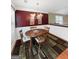 Charming dining area featuring a wooden table, chandelier, and decorative wall art at 120 Hawken Trl, Mcdonough, GA 30253