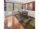 Elegant dining room with stylish decor, a chandelier, and access to the deck at 120 Hawken Trl, Mcdonough, GA 30253