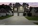 Charming two-story home boasts a brick facade, two-car garage, and well-manicured lawn at 120 Hawken Trl, Mcdonough, GA 30253