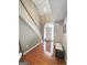 Bright foyer featuring hardwood floors, high ceilings, staircase, and front door with transom window at 120 Hawken Trl, Mcdonough, GA 30253