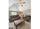 Cozy living room featuring plush seating, neutral tones, and a ceiling fan at 120 Hawken Trl, Mcdonough, GA 30253