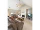 Cozy living room with a fireplace, ceiling fan, and a television on a stand at 120 Hawken Trl, Mcdonough, GA 30253