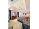 Serene main bedroom with tray ceiling, dresser, and access to the bathroom at 120 Hawken Trl, Mcdonough, GA 30253