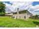 View of the home and yard showcasing a two-story home with a grassy lawn at 1849 Wanda Way, Ellenwood, GA 30294