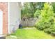 Fenced backyard has a playset and green lawn at 1849 Wanda Way, Ellenwood, GA 30294