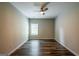 Spacious bedroom with new, dark-wood flooring, a ceiling fan, and a window at 1849 Wanda Way, Ellenwood, GA 30294
