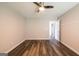 Bright bedroom features ceiling fan, neutral walls, and wood-look flooring at 1849 Wanda Way, Ellenwood, GA 30294