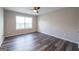 This is an empty bedroom with a window and ceiling fan at 1849 Wanda Way, Ellenwood, GA 30294