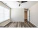 This is an empty bedroom with a window and ceiling fan at 1849 Wanda Way, Ellenwood, GA 30294