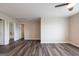 Spacious bedroom features wood-look floors, a ceiling fan, and ensuite bathroom at 1849 Wanda Way, Ellenwood, GA 30294