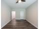 Bedroom featuring vinyl flooring, a ceiling fan, and access to other rooms at 1849 Wanda Way, Ellenwood, GA 30294