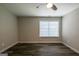 Bedroom features hardwood floors, a ceiling fan, and a window at 1849 Wanda Way, Ellenwood, GA 30294