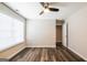 Bedroom features hardwood floors, a ceiling fan, and a window at 1849 Wanda Way, Ellenwood, GA 30294