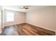 Comfortable bedroom featuring natural light, wood floors, and a ceiling fan, offering a relaxing atmosphere at 1849 Wanda Way, Ellenwood, GA 30294