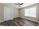 This bedroom has a large window and a ceiling fan at 1849 Wanda Way, Ellenwood, GA 30294