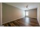 Bedroom with vinyl flooring, a ceiling fan, and a large, bright window at 1849 Wanda Way, Ellenwood, GA 30294