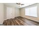 Bedroom features hardwood floors, a ceiling fan, and a window at 1849 Wanda Way, Ellenwood, GA 30294