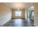 Open-concept dining area with wood floors, neutral walls, and access to other living spaces at 1849 Wanda Way, Ellenwood, GA 30294