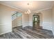 Spacious dining area with hardwood floors, entryways, and lots of natural light at 1849 Wanda Way, Ellenwood, GA 30294