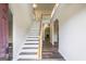 Elegant foyer showcasing stairs, hardwood flooring, and access to living spaces at 1849 Wanda Way, Ellenwood, GA 30294