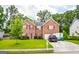 Charming brick home with a well-kept lawn, driveway, and mature trees in a desirable location at 1849 Wanda Way, Ellenwood, GA 30294
