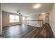 Open upstairs hallway featuring vinyl flooring, railing, and natural light at 1849 Wanda Way, Ellenwood, GA 30294