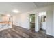 Open hallway area featuring vinyl flooring, white trim, and access to a bathroom at 1849 Wanda Way, Ellenwood, GA 30294
