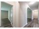 Hallway with hardwood floors and open doorways at 1849 Wanda Way, Ellenwood, GA 30294