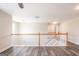 Bright, open landing features wood-look floors and a white wood banister at 1849 Wanda Way, Ellenwood, GA 30294