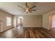 Bright living room featuring wood floors and a ceiling fan for comfortable living at 1849 Wanda Way, Ellenwood, GA 30294