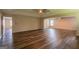 Open-concept living room with an archway features recessed lighting and wood flooring, creating a modern feel at 1849 Wanda Way, Ellenwood, GA 30294