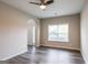 Inviting living room with dark wood floors, large window, and open layout at 1849 Wanda Way, Ellenwood, GA 30294