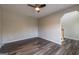 Minimalist living room featuring hardwood floors, ceiling fan, and neutral walls at 1849 Wanda Way, Ellenwood, GA 30294