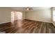 Large open-concept living area with wood-look floors, and ample natural light at 1849 Wanda Way, Ellenwood, GA 30294