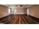 Bright and airy living room features tray ceilings, wood flooring, and natural light from a window at 1849 Wanda Way, Ellenwood, GA 30294