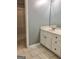 Bathroom with single sink vanity and walk-in shower at 1433 Cotton Sw Trl, Conyers, GA 30094