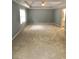 Spacious bedroom with neutral carpet, gray walls, ceiling fan, and a tray ceiling at 1433 Cotton Sw Trl, Conyers, GA 30094