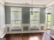 Formal dining room with hardwood floors, chair rail, and decorative chandelier at 1433 Cotton Sw Trl, Conyers, GA 30094