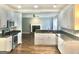 Spacious kitchen with white cabinets, stainless steel appliances, and hardwood flooring at 1433 Cotton Sw Trl, Conyers, GA 30094