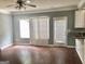 Open-concept living room with hardwood floors, patio access, and recessed lighting at 1433 Cotton Sw Trl, Conyers, GA 30094