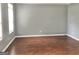 Expansive living room featuring hardwood floors and natural light at 1433 Cotton Sw Trl, Conyers, GA 30094