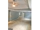 Large main bedroom with carpet, ceiling fan, and ensuite bathroom access at 1433 Cotton Sw Trl, Conyers, GA 30094