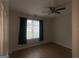 Bedoom featuring laminate floors and a ceiling fan, a large window providing natural light at 14104 Fairington Ridge Cir, Lithonia, GA 30038