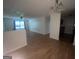 Open-concept living area with laminate flooring, a ceiling fan, and lots of natural light at 14104 Fairington Ridge Cir, Lithonia, GA 30038