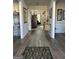 Open foyer with hardwood flooring and views into other rooms of the home at 5725 Lake Windsor Pkwy, Buford, GA 30518
