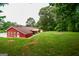 Wide view of the backyard and exterior of the home at 125 Point View Ct, Tyrone, GA 30290
