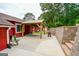 Backyard with covered patio and stone retaining wall at 125 Point View Ct, Tyrone, GA 30290